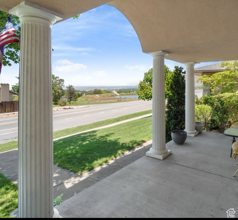 View of patio / terrace featuring a water view