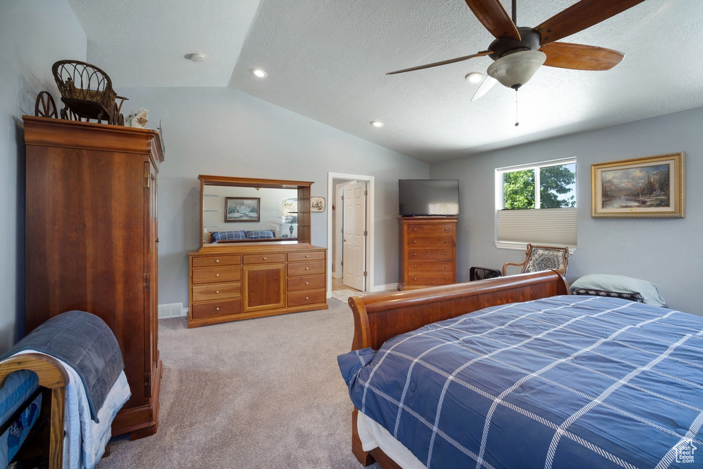 Bedroom featuring vaulted ceiling, light colored carpet, recessed lighting, a ceiling fan, and baseboards