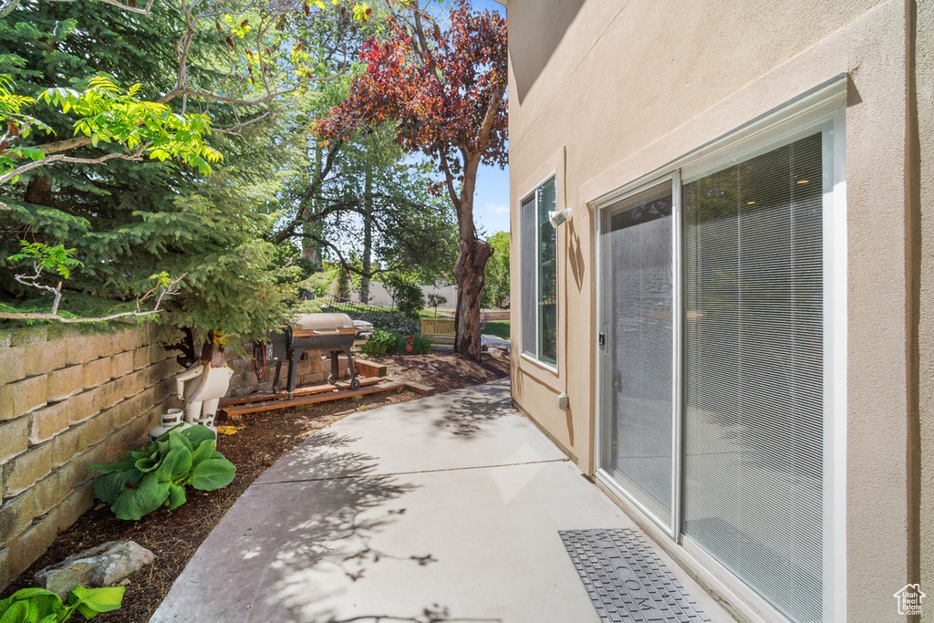 View of patio / terrace featuring a grill and fence