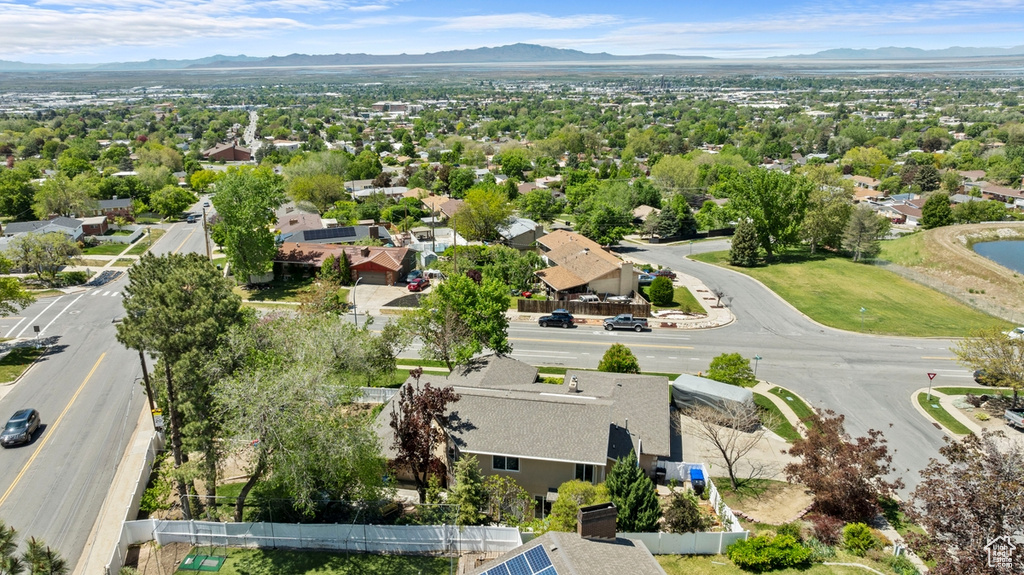 Aerial perspective of suburban area with a mountain backdrop