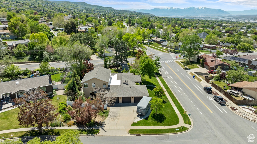 Aerial perspective of suburban area featuring a mountainous background