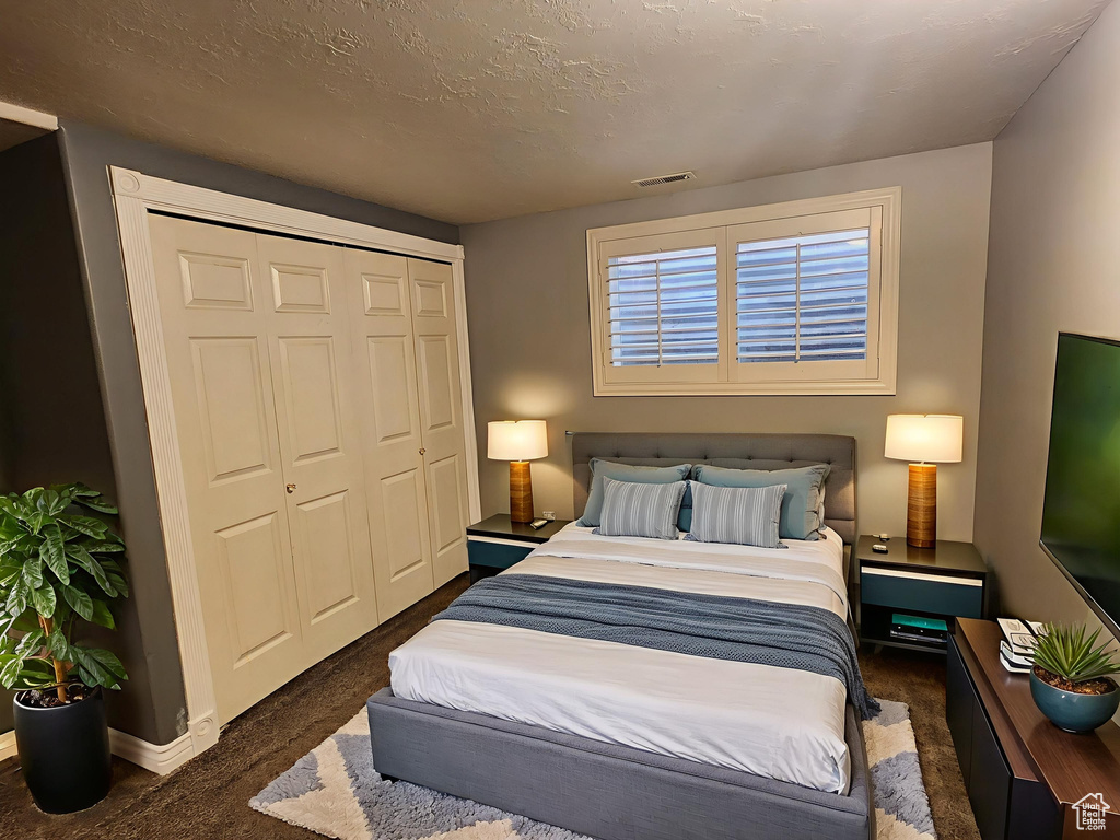Bedroom featuring a closet and carpet floors