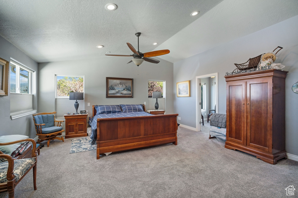 Bedroom featuring light colored carpet, vaulted ceiling, a textured ceiling, baseboards, and recessed lighting