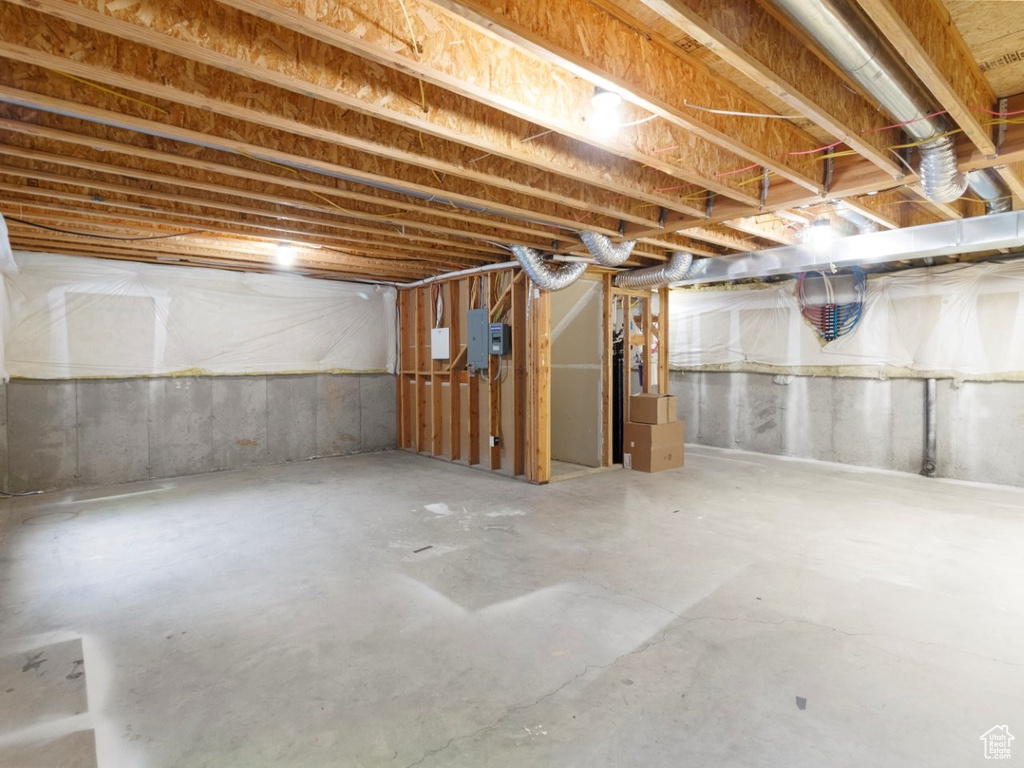 Unfinished below grade area with electric panel