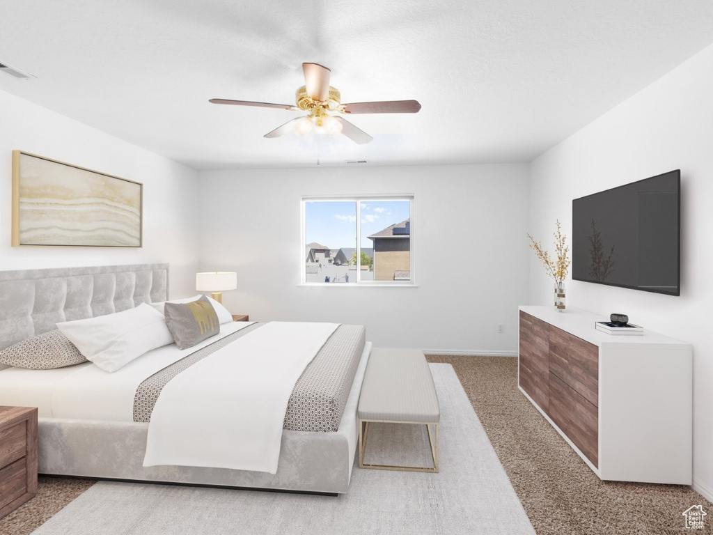 Bedroom with carpet flooring, a ceiling fan, and baseboards