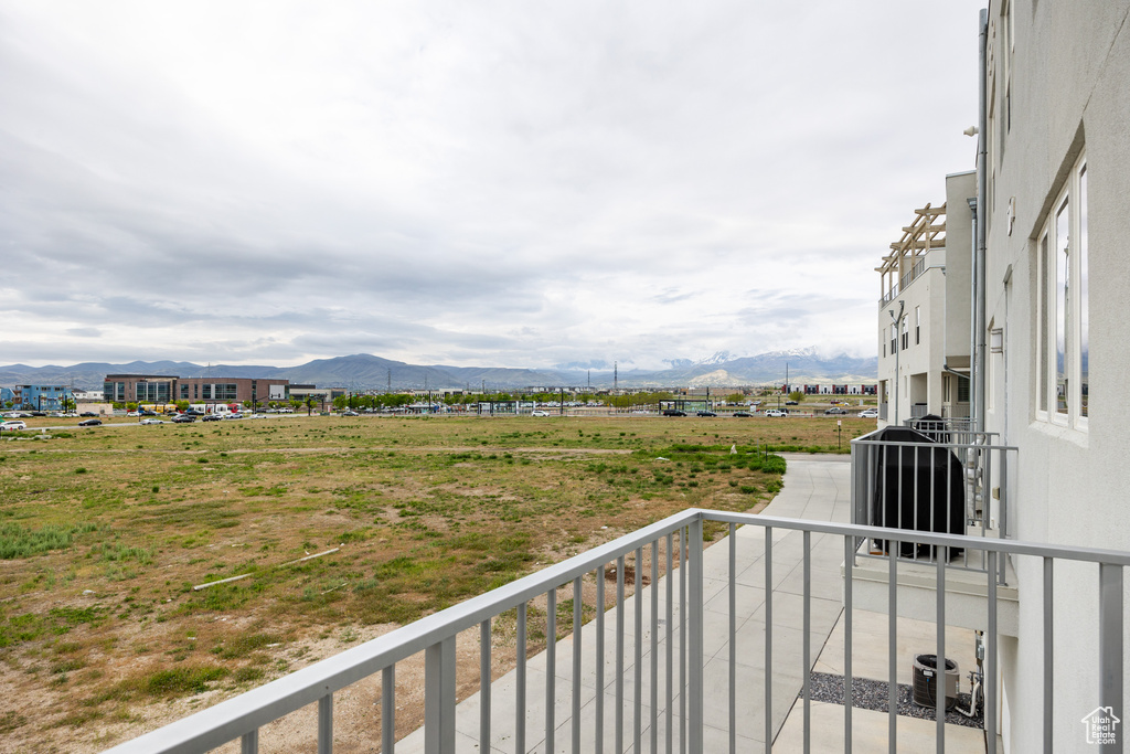 Balcony with a mountain view, a view of rural / pastoral area, and cooling unit