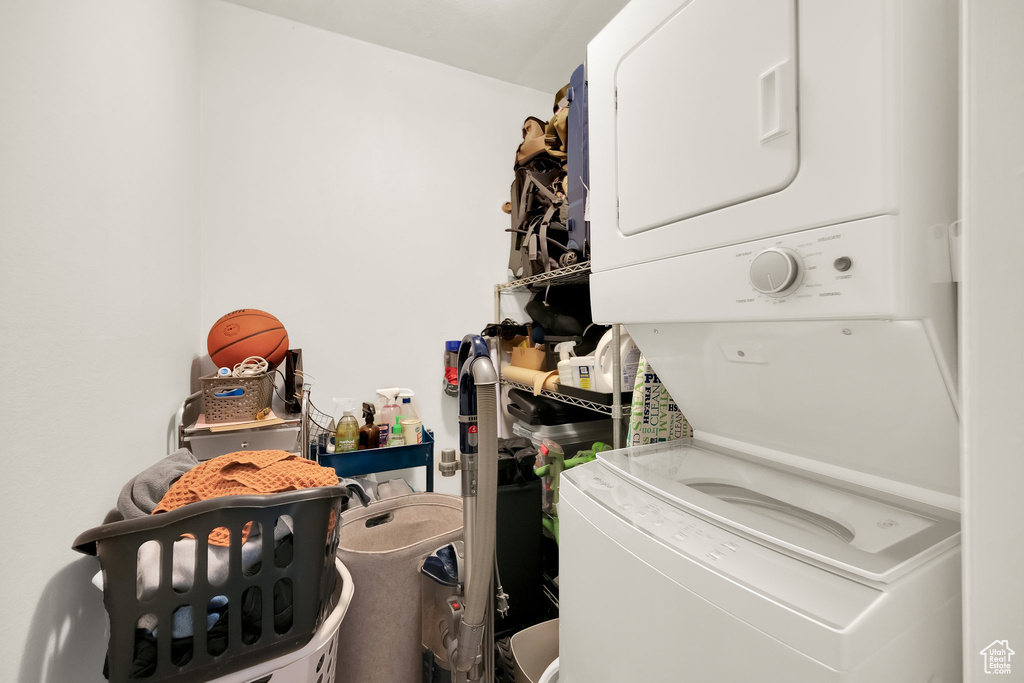 Laundry area featuring stacked washer / drying machine