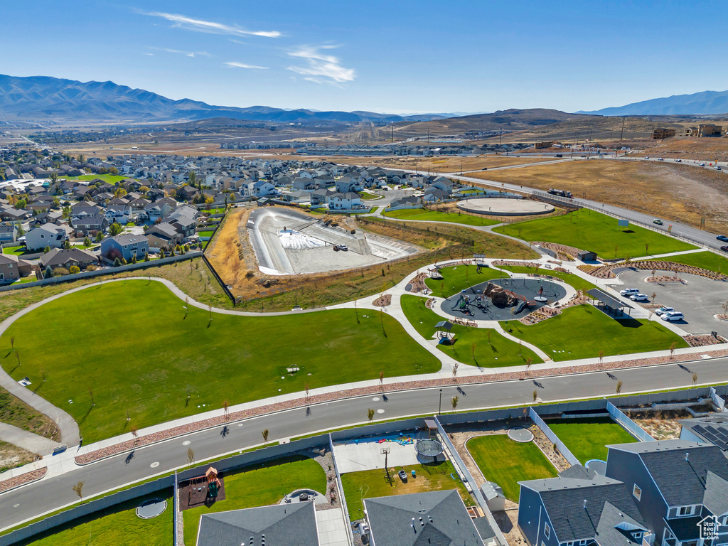 Aerial view of residential area featuring a mountainous background