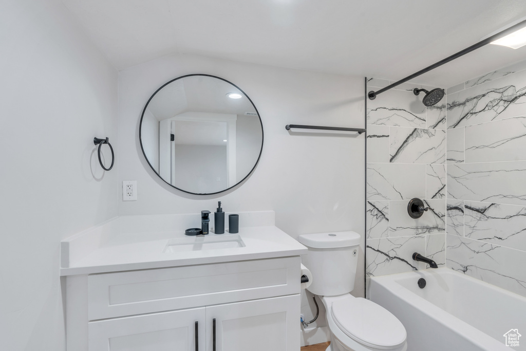 Bathroom with vanity, washtub / shower combination, and toilet