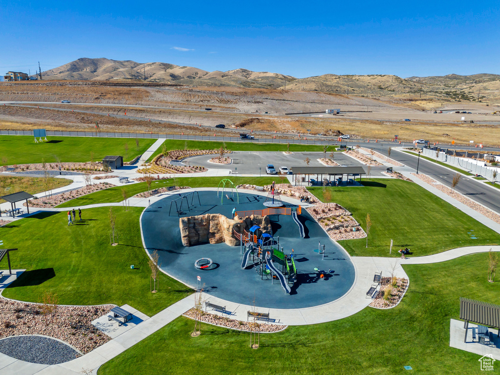 Drone / aerial view of a community park and a mountainous background