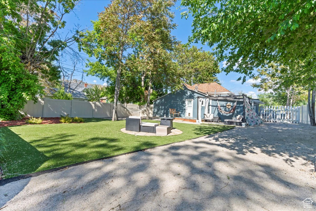 View of yard featuring a patio area and an outdoor hangout area