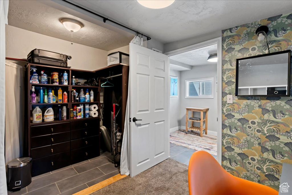 Spacious closet with tile patterned floors