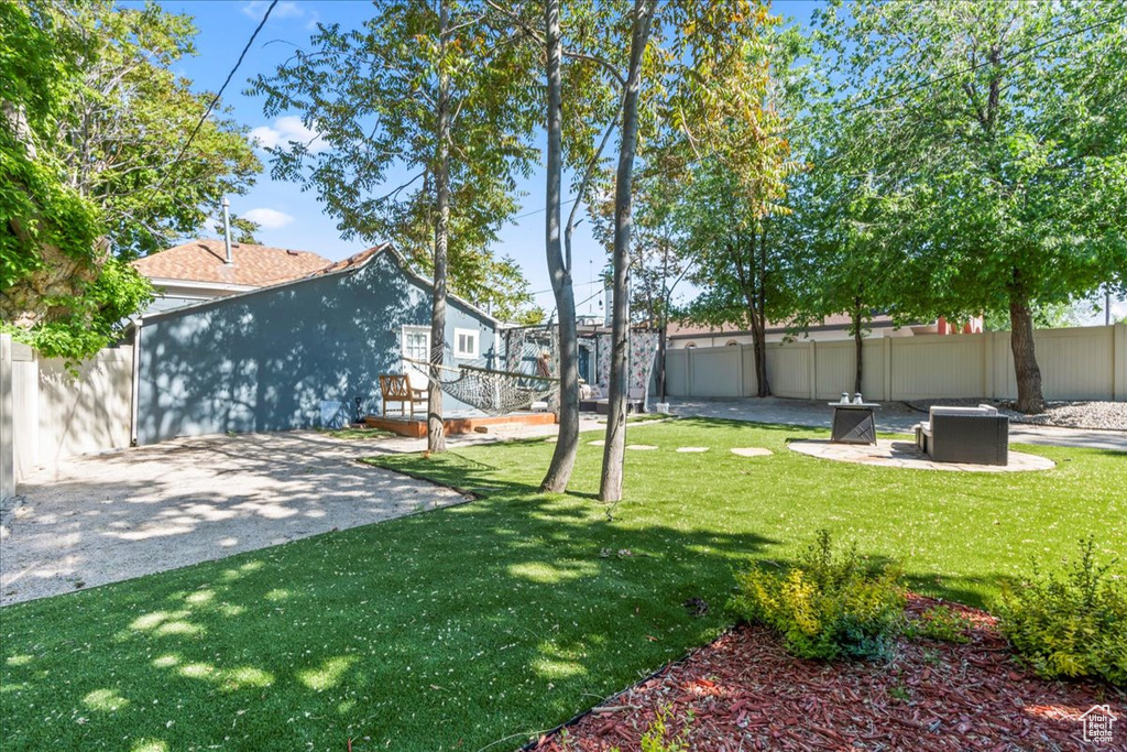 View of yard with a patio