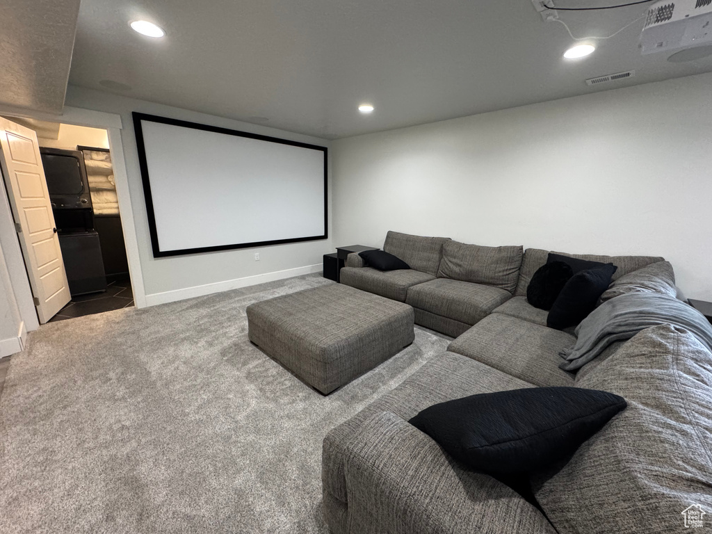 Carpeted cinema with baseboards and recessed lighting