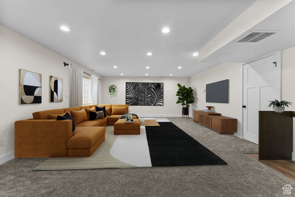 Living room with recessed lighting, carpet floors, and baseboards