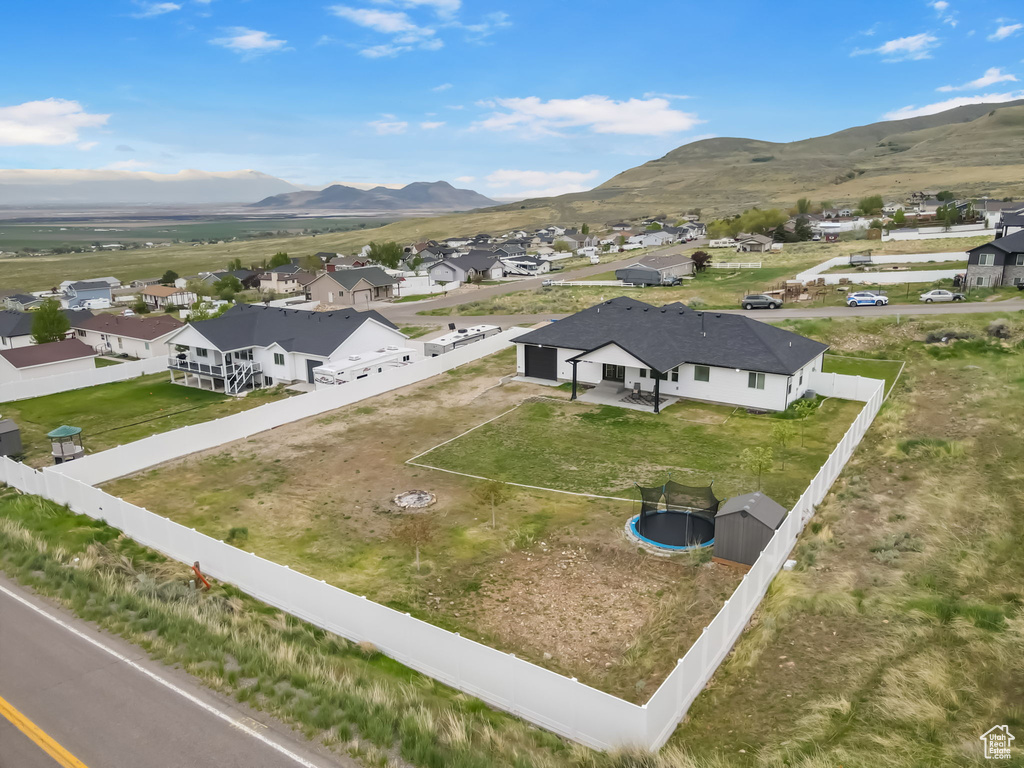 Aerial view of residential area featuring mountains