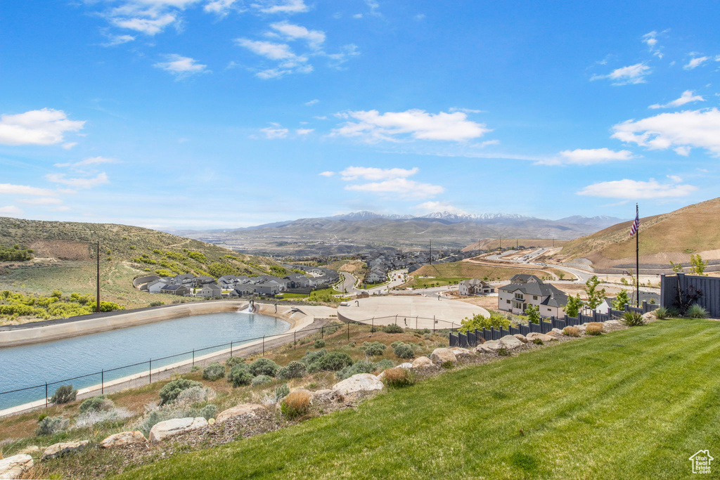 Aerial view of a mountain backdrop and a pool
