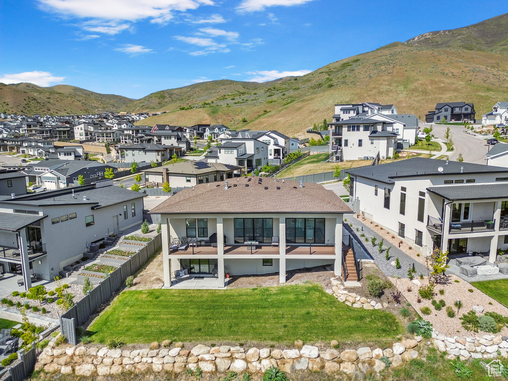 Aerial perspective of suburban area with a mountain backdrop