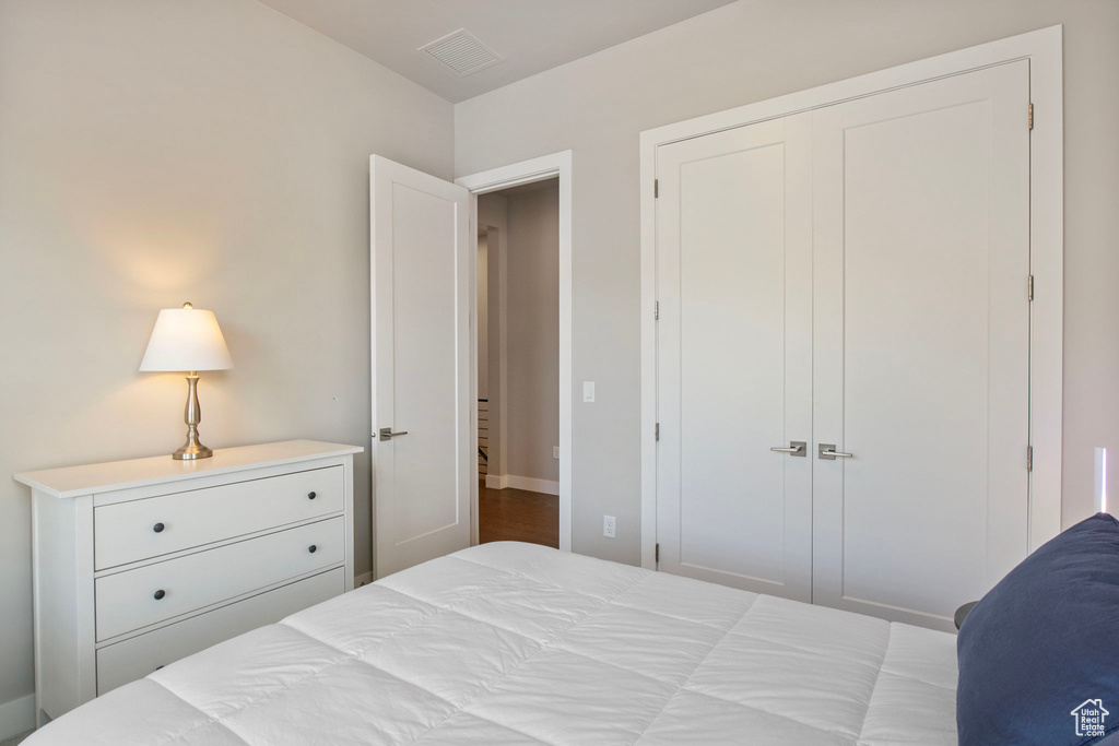 Bedroom with a closet and baseboards