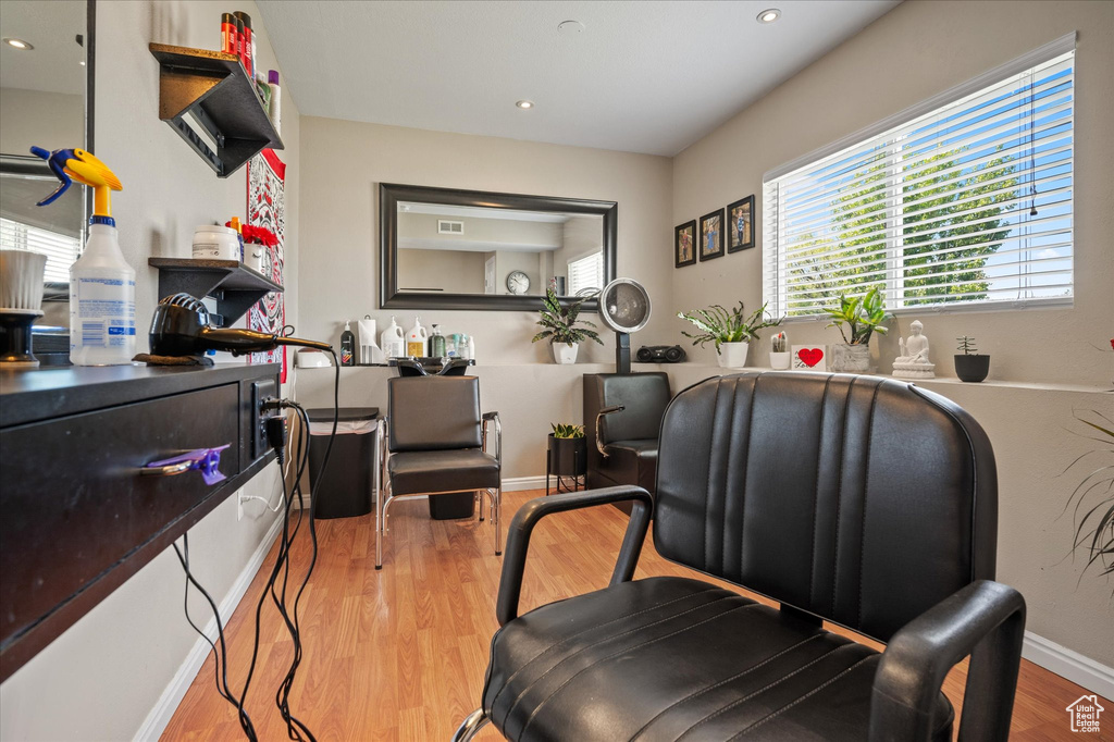 Home office featuring wood finished floors, recessed lighting, and baseboards