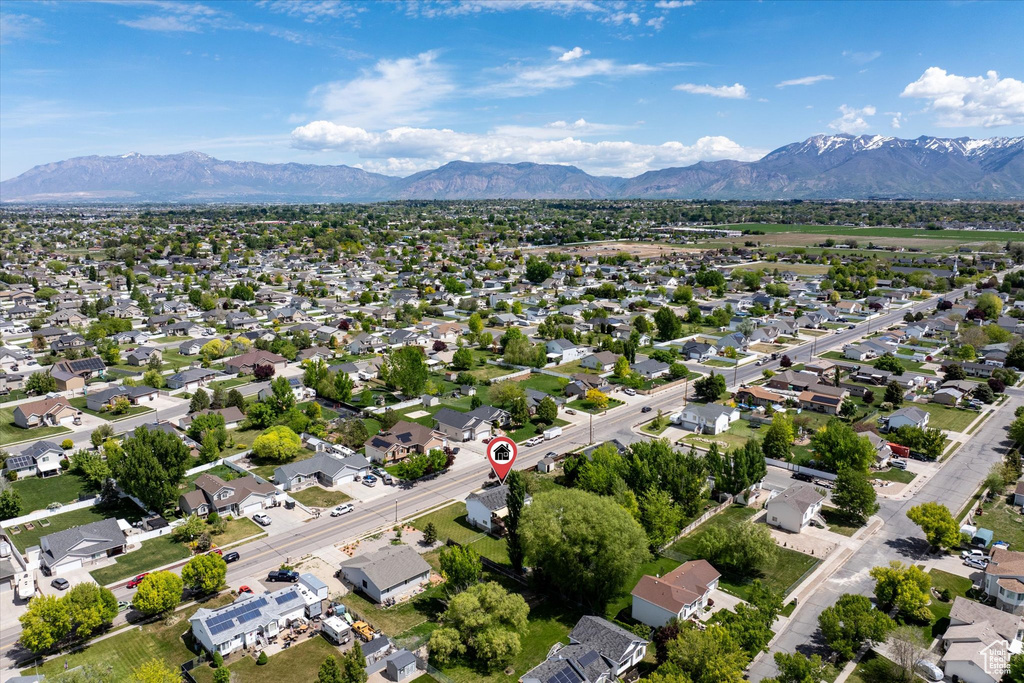 Aerial perspective of suburban area with a mountainous background