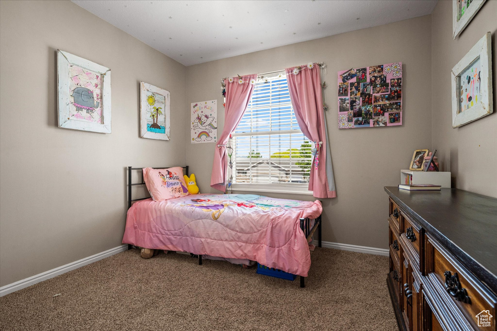 Carpeted bedroom with baseboards