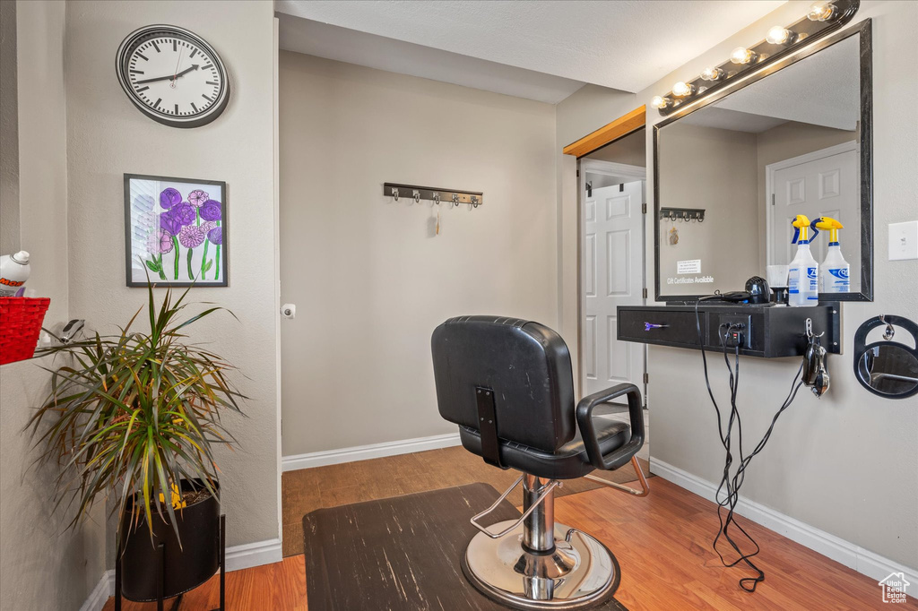 Home office featuring wood finished floors and baseboards