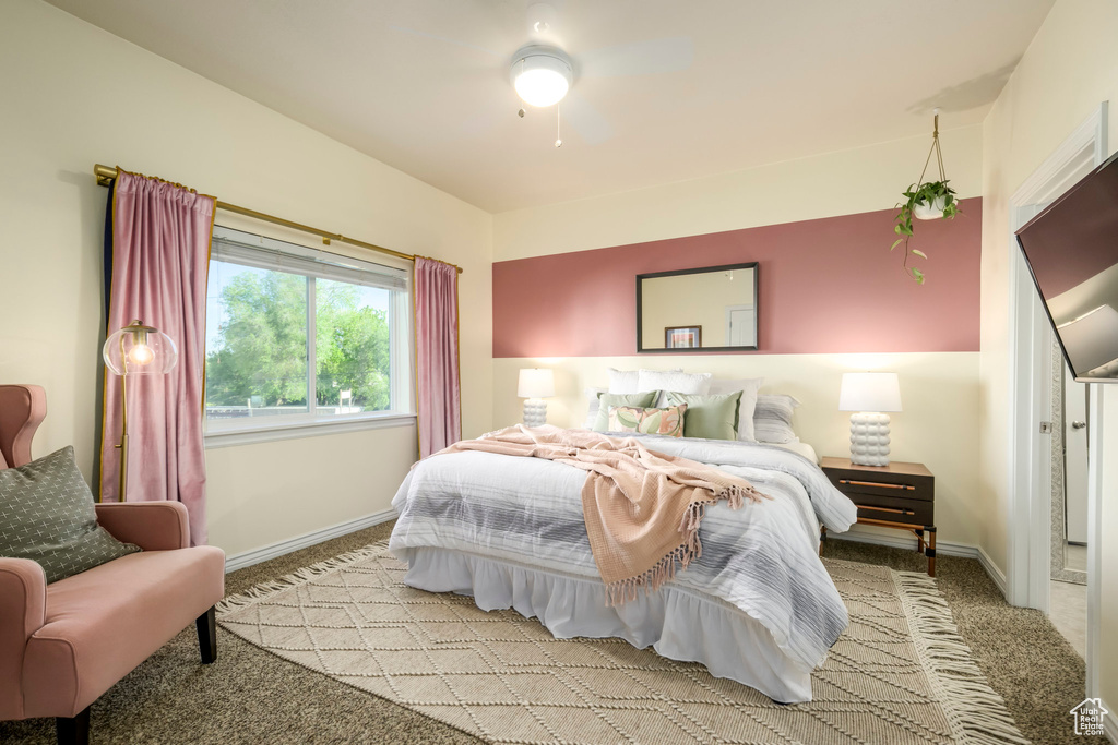 Bedroom featuring light colored carpet and baseboards