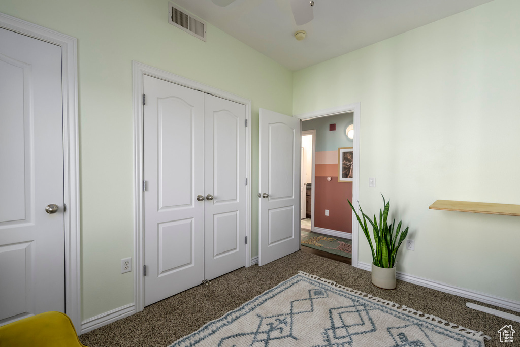Bedroom featuring carpet, baseboards, a closet, and ceiling fan