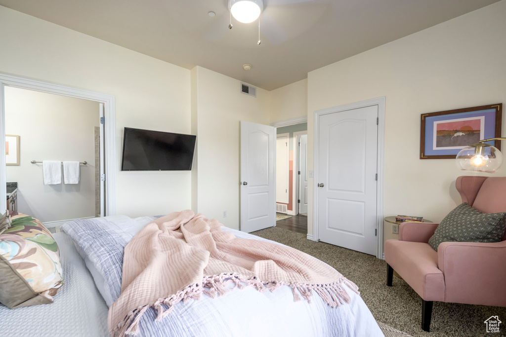 Carpeted bedroom with ceiling fan