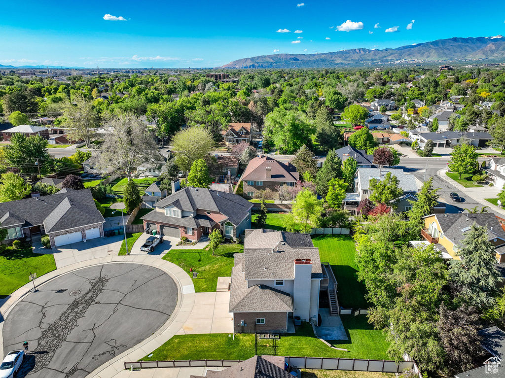 Aerial view of residential area with a mountainous background