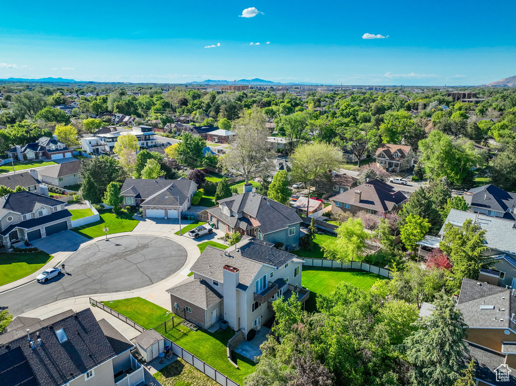 Aerial perspective of suburban area with a mountain backdrop