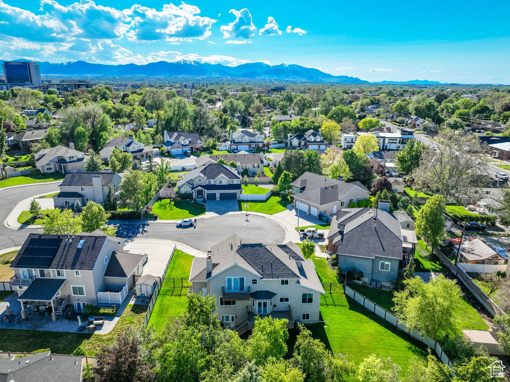 Aerial perspective of suburban area with a mountain backdrop