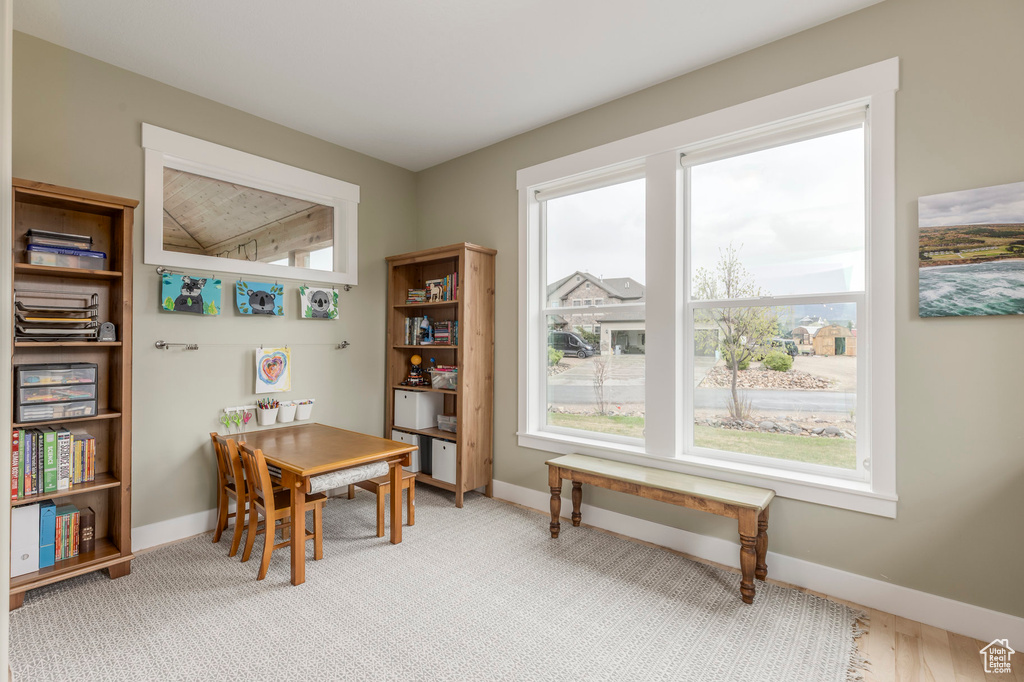 Dining room featuring plenty of natural light and baseboards