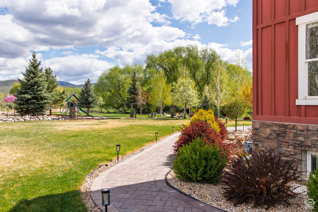 View of property's community with a yard and a mountain view