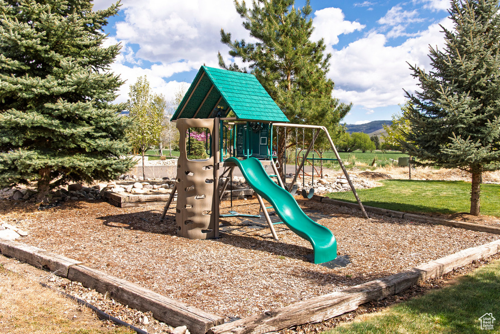 View of playground with a mountain view