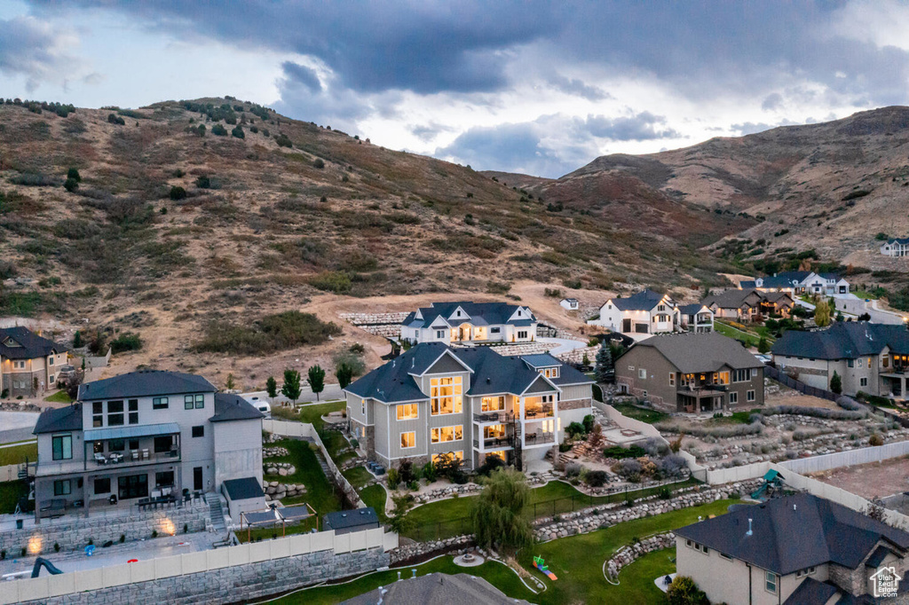 Aerial perspective of suburban area featuring a mountainous background