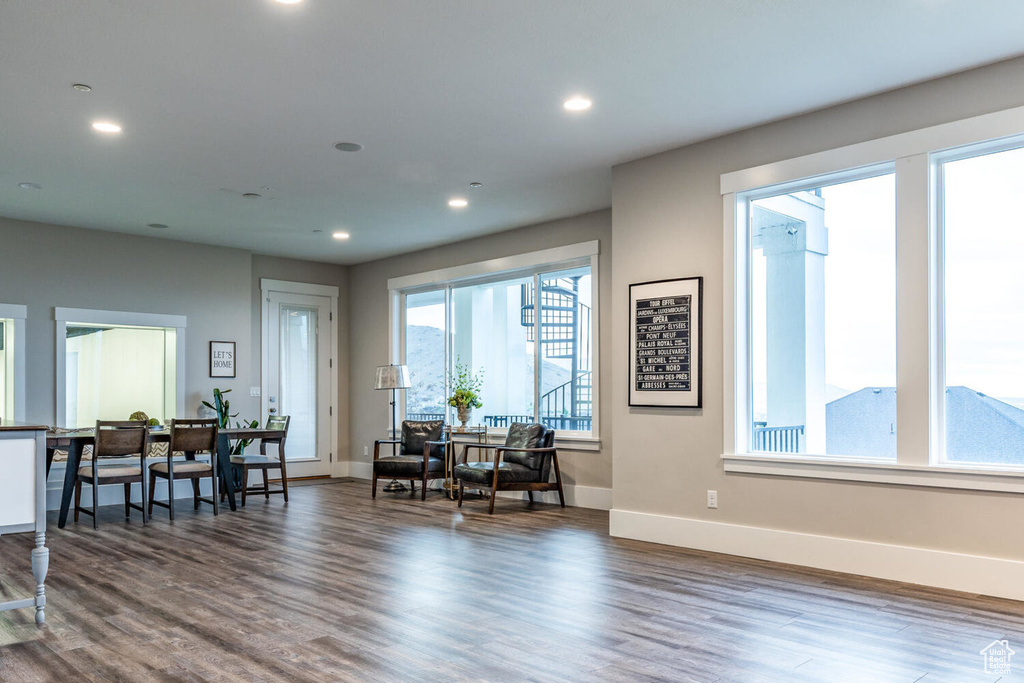 Dining area featuring wood finished floors, baseboards, and recessed lighting