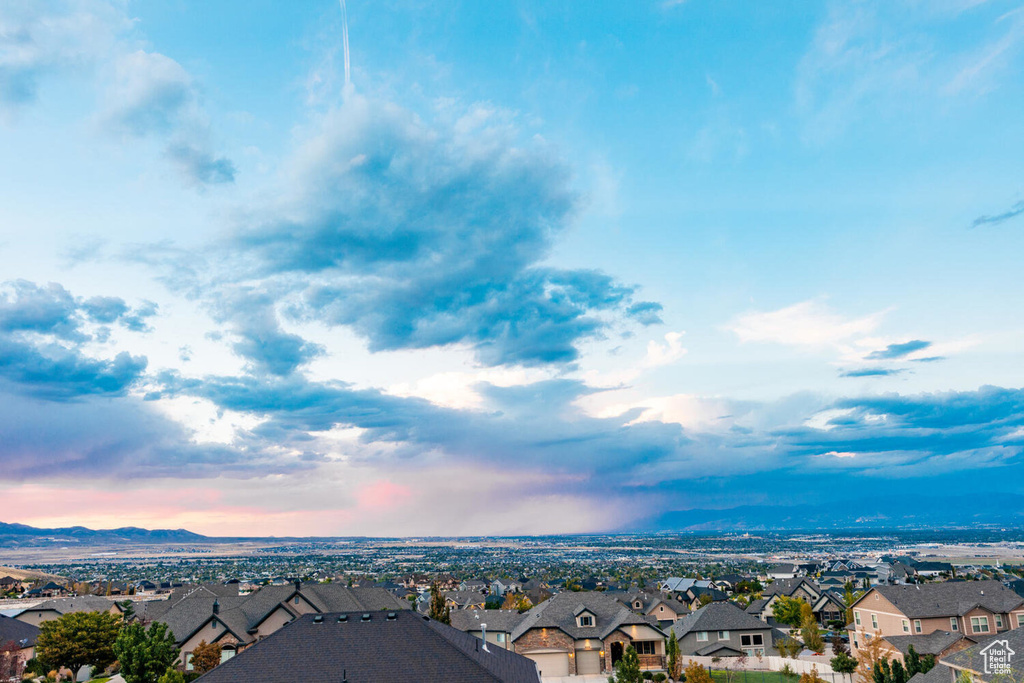 Aerial view at dusk of a residential view and a mountain view