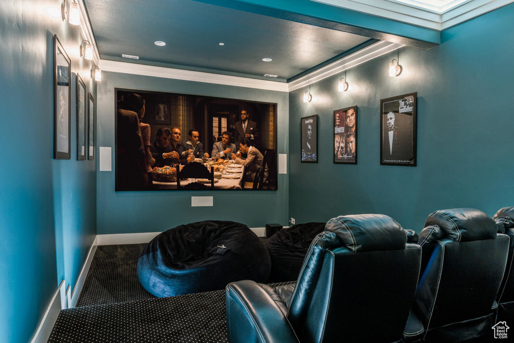 Carpeted cinema with ornamental molding, baseboards, and recessed lighting