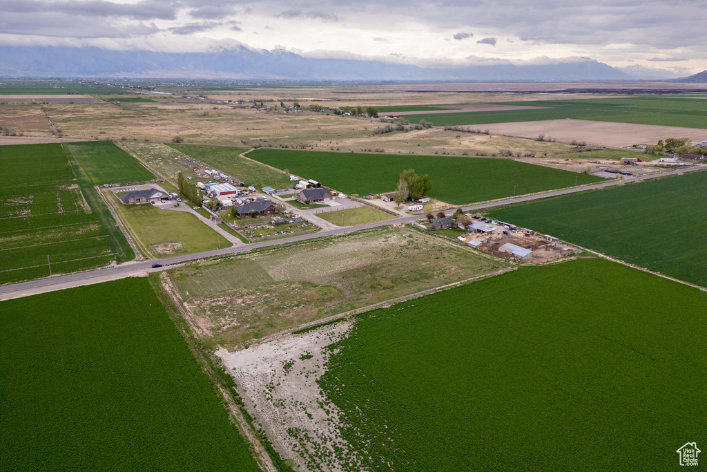 Aerial view of property's location featuring rural landscape and a mountain backdrop