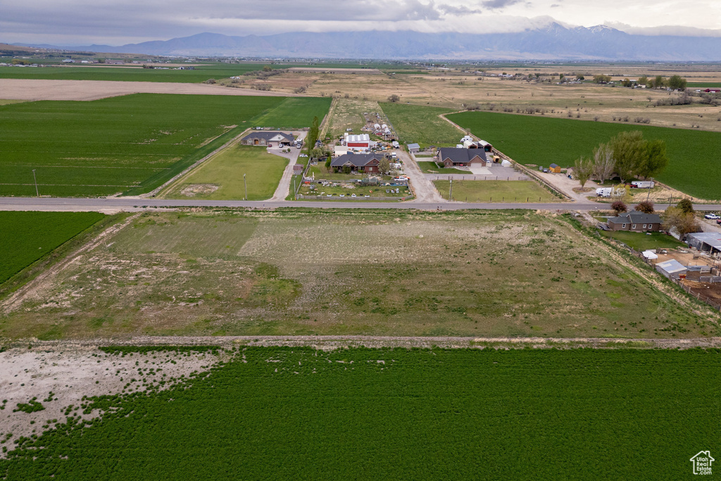 Aerial view of property and surrounding area with rural landscape and mountains