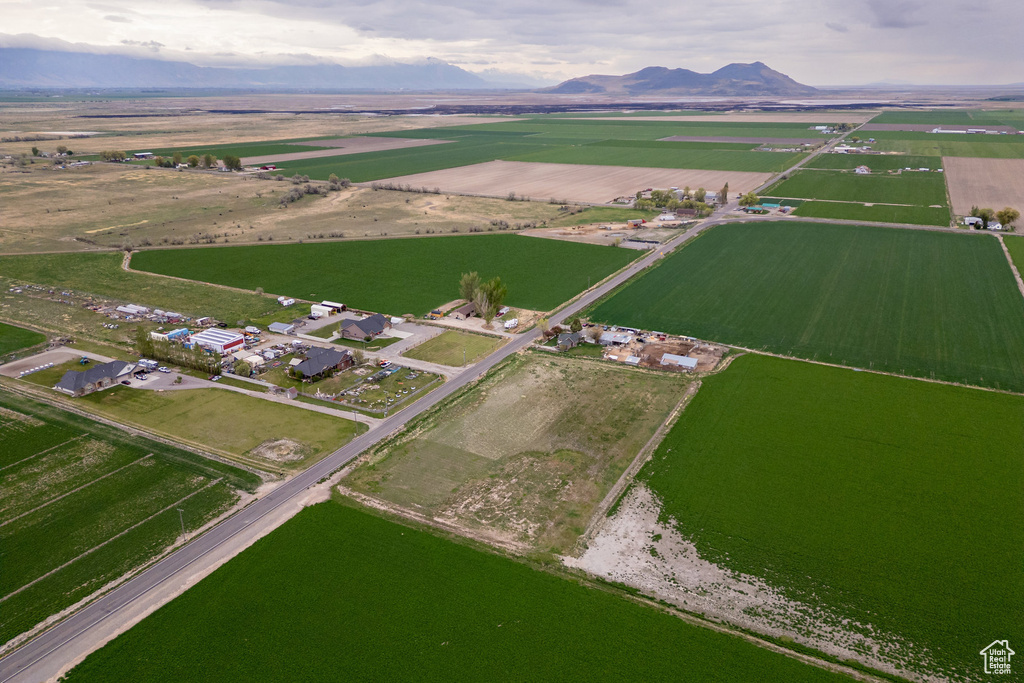 Aerial overview of property's location featuring rural landscape and a mountainous background