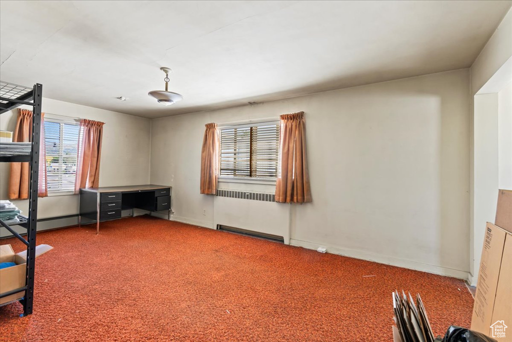Unfurnished bedroom featuring carpet floors and baseboards