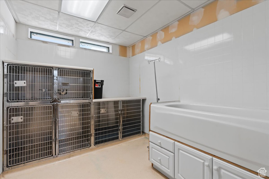 Bathroom featuring a drop ceiling