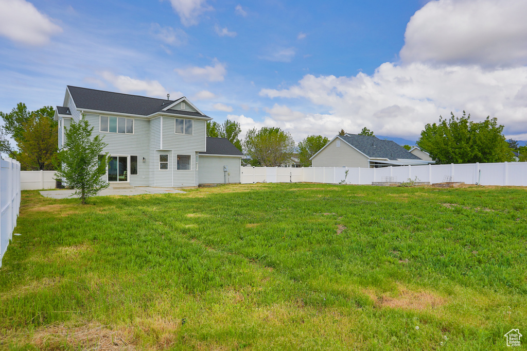 Rear view of house with a patio area