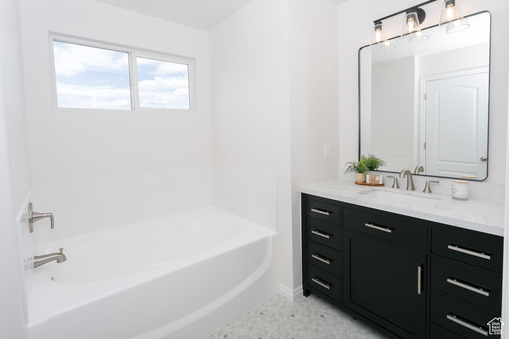 Bathroom with vanity and a garden tub