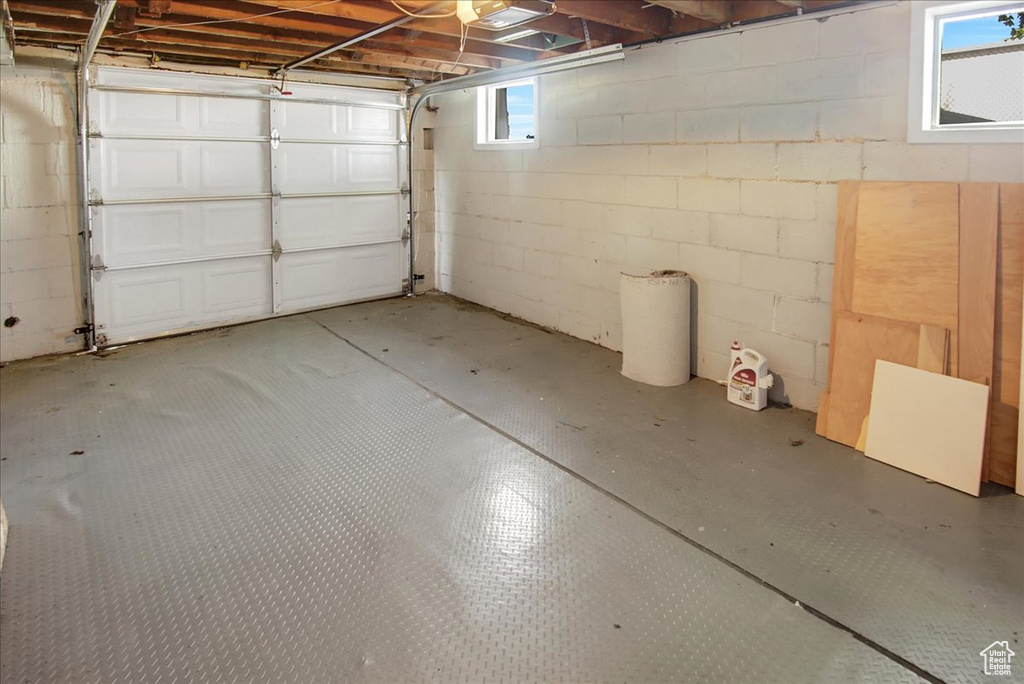 Garage featuring concrete block wall