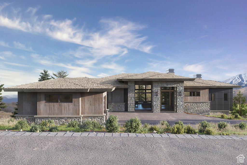 Prairie-style house featuring stone siding