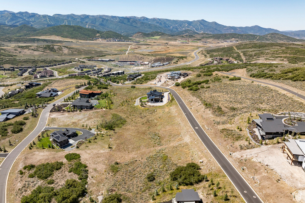 Aerial overview of property's location with a mountainous background